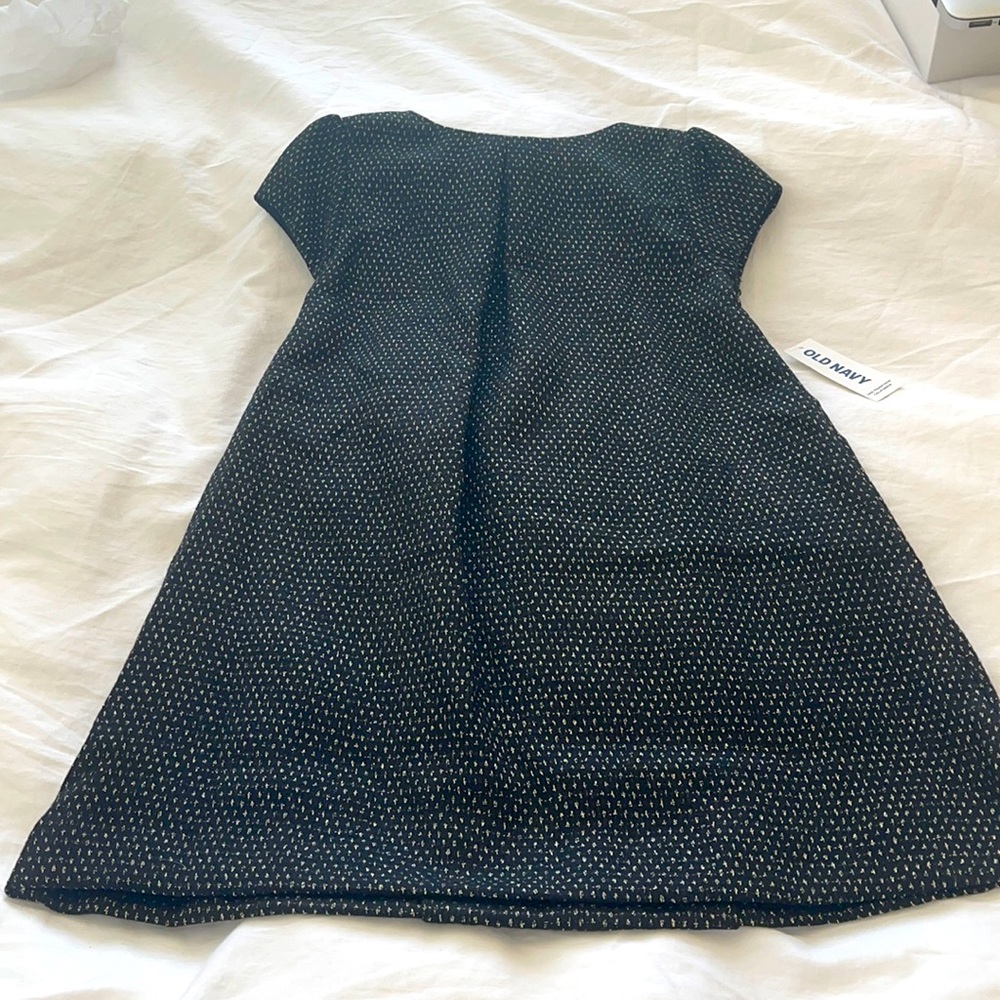 Black and gold holiday dress with cap sleeves.